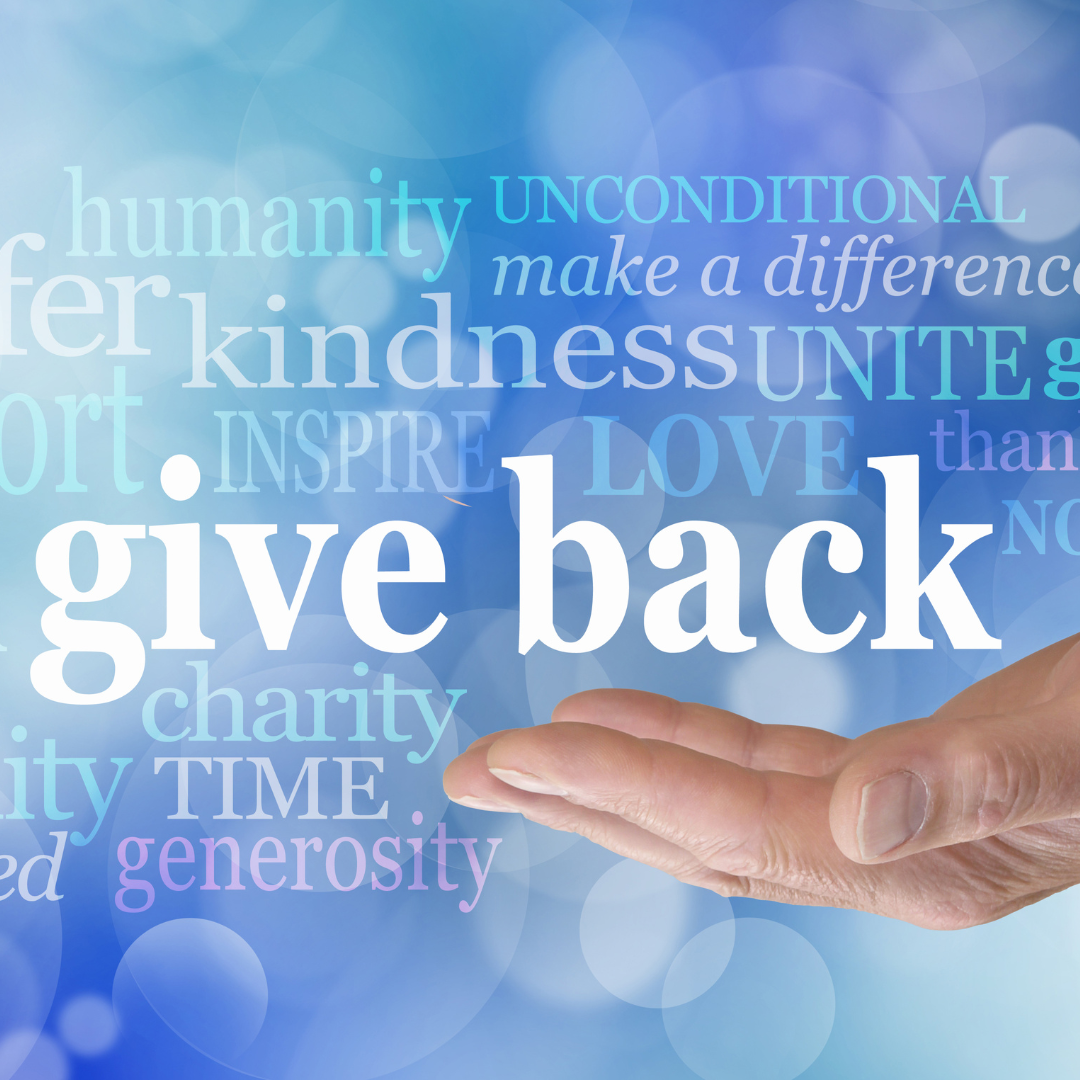 A hand with positive words above suck as Give Back