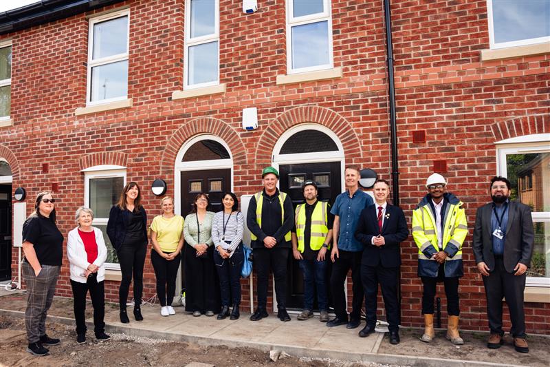 Guests posing for photo at Shawe View in Urmston