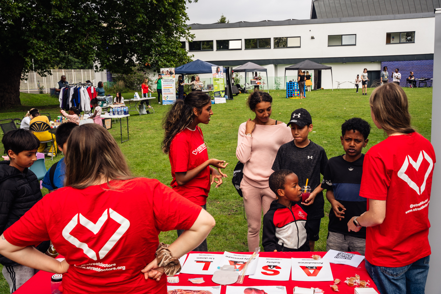 Residents enjoying games at moss side rec park